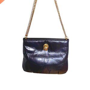 1970s/80s leather bag with cougar head and chain strap by Ruth Saltz